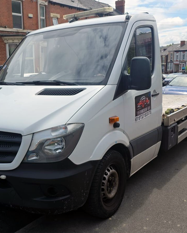 Black Mercedes-Benz flatbed recovery truck ready for deployment in Sheffield